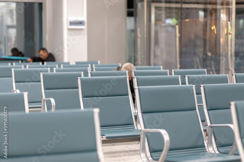 Empty airport terminal waiting area with chairs. Close up photo.