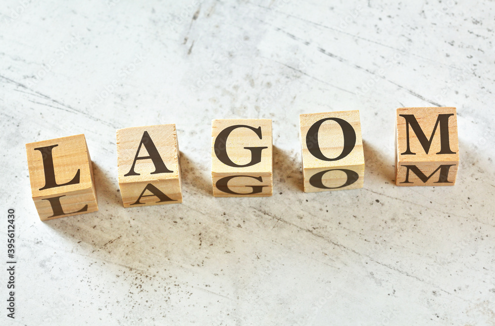 Five wooden cubes with Scandinavian word LAGOM (means Five wooden cubes with Scandinavian word LAGOM (means