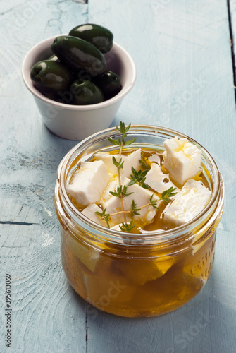 Feta cheese marinated in olive oil and herbs photo