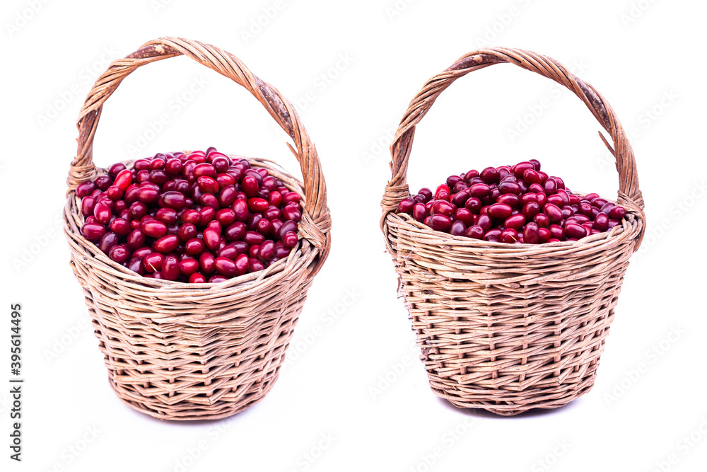 Fresh cornel berries. Fresh dogwood red berries with green leafs in wooden basket isolated on white background. Fresh cornel berries. Fresh dogwood red berries with green leafs in wooden basket isolated on white background.