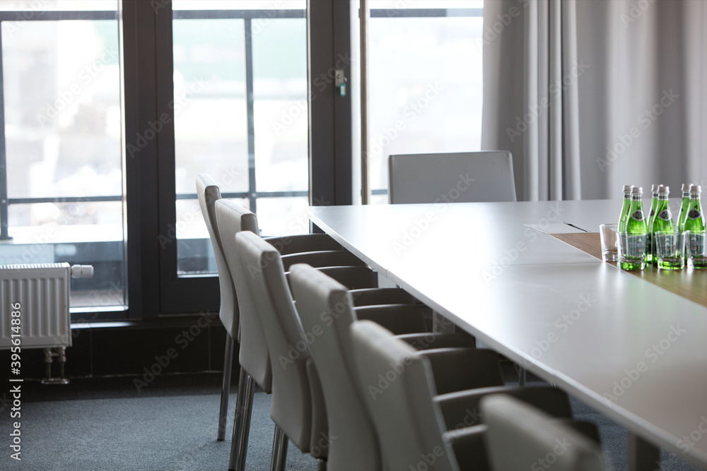 Chairs at conference table in modern office