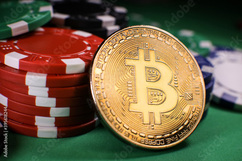 Wallpaper Mural Bitcoin gold coin with poker chips on a green poker table against black background. Blockchain casino. Online gambling.  Torontodigital.ca