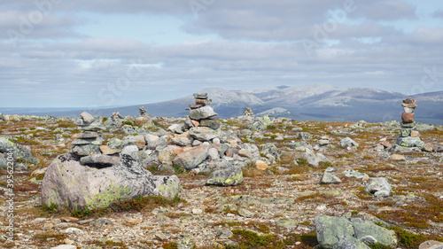 Stones and towers stacked with stones on the summit of Vastervalen, Sweden photo