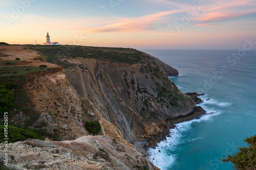 Cabo Espichel cape at sunset with sea cliffs and atlantic ocean landscape, in Portugal