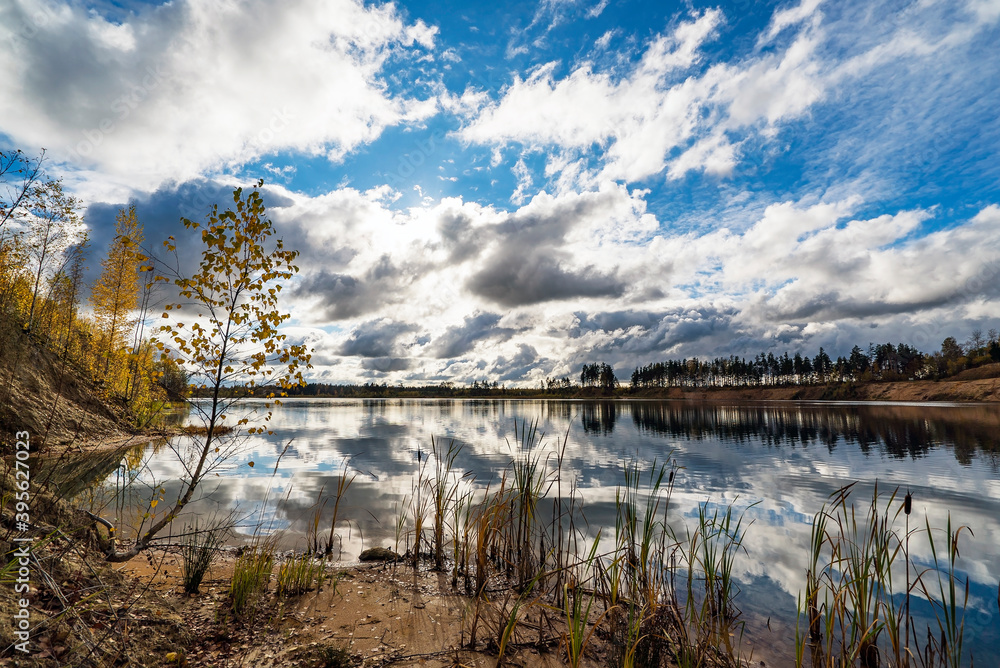 Autumn landscape with beautiful clouds over the lake with a mirror image. Autumn landscape with beautiful clouds over the lake with a mirror image.