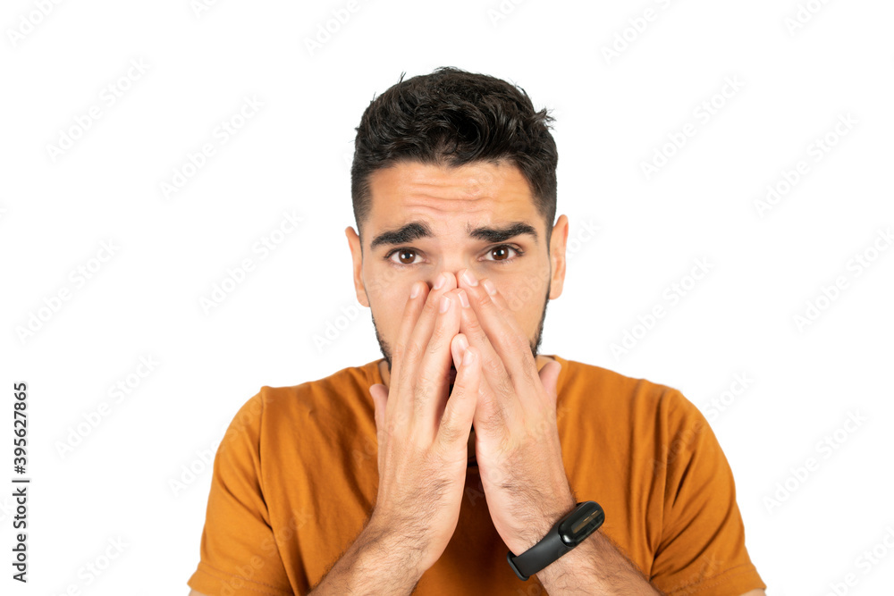 Portrait of young man looking scared. Portrait of young man looking scared.