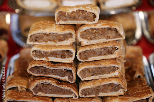 Various flavor strudel for sale in pastry shop photo