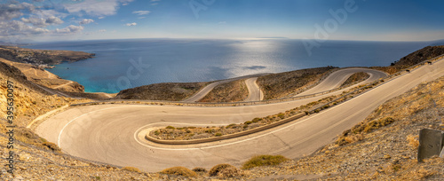 Breathtakingly steep and curvy roads climbing the coastal cliffs of the Sfakia region of Southern Crete, Greece photo