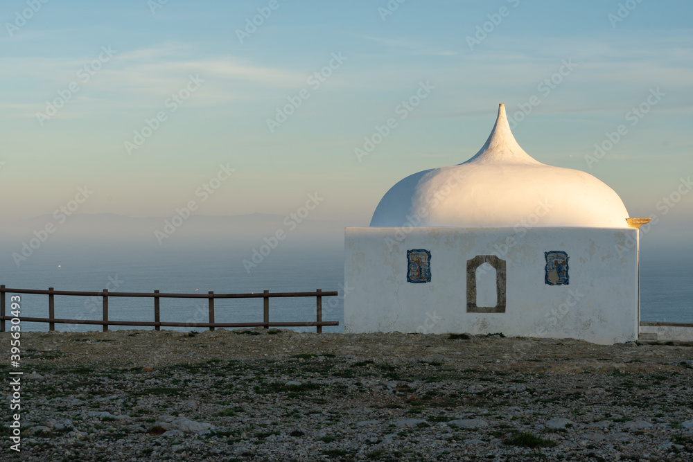 Church Ermida da Memoria at Cabo Espichel Cape with the atlantic ocean in the background, in Portugal