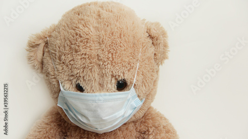 toy Teddy bear in a protective mask from viruses close-up