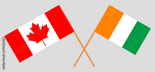 Crossed flags of Canada and Republic of Ivory Coast