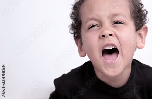 boy shouting in rage on white background stock photo