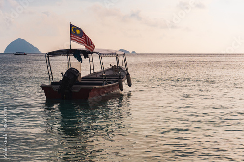 Wallpaper Mural Boat with Malaysian flag at the beach during sunset at Perhentian Islands. Torontodigital.ca