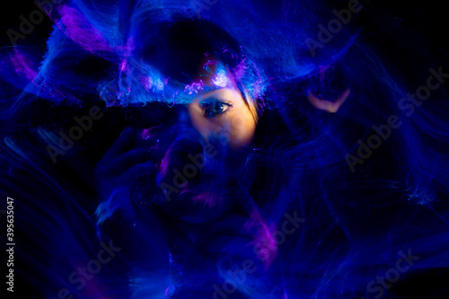 lightpainting portrait, new art direction, long exposure photo , light drawing at long exposure