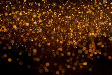 Closeup shot of beautiful orange glitter for wallpaper or background