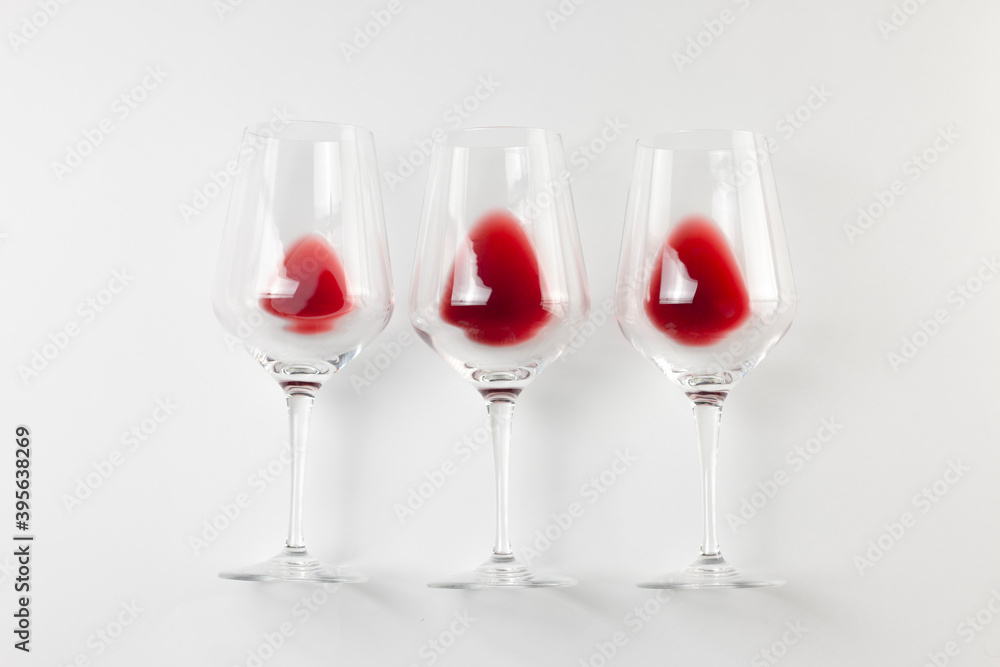 Glasses with red wine on white background. Wine flat lay, top view, degustation, holyday concept. Glasses with red wine on white background. Wine flat lay, top view, degustation, holyday concept.