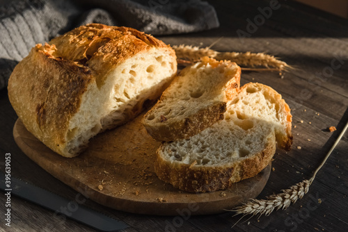 Various rustic bread on a wooden board. Healthy food and farming concept