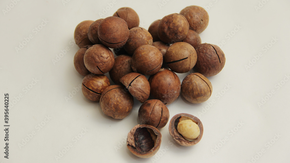macadamia nuts lie in the form of a heart on a white background macadamia nuts lie in the form of a heart on a white background