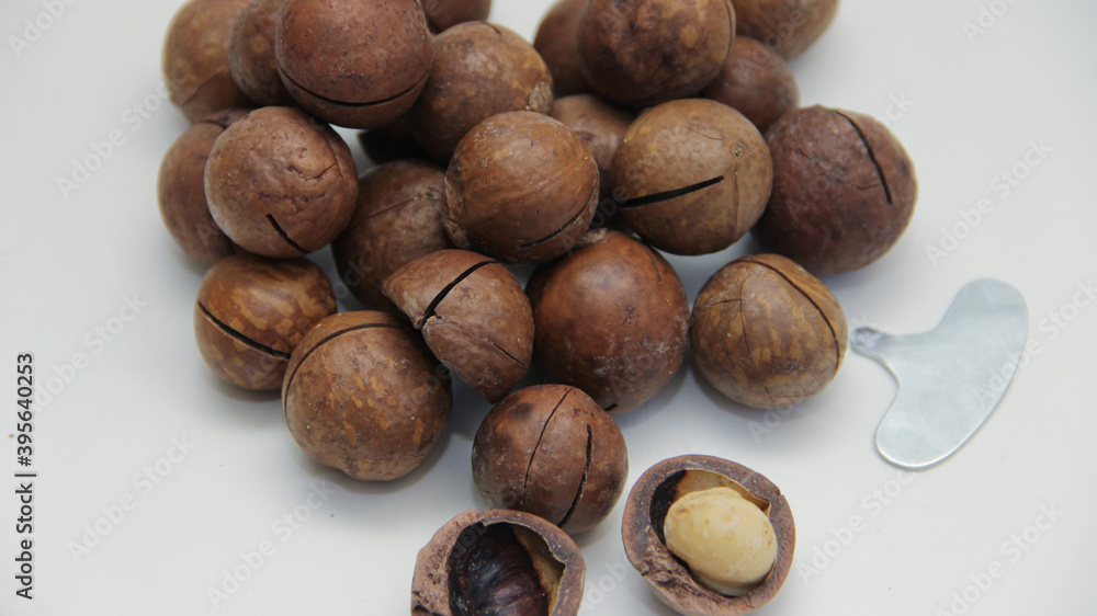 macadamia nuts lie in the form of a heart on a white background macadamia nuts lie in the form of a heart on a white background