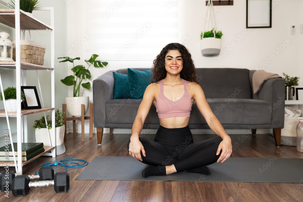 Portrait of hispanic woman doing a yoga pose Portrait of hispanic woman doing a yoga pose