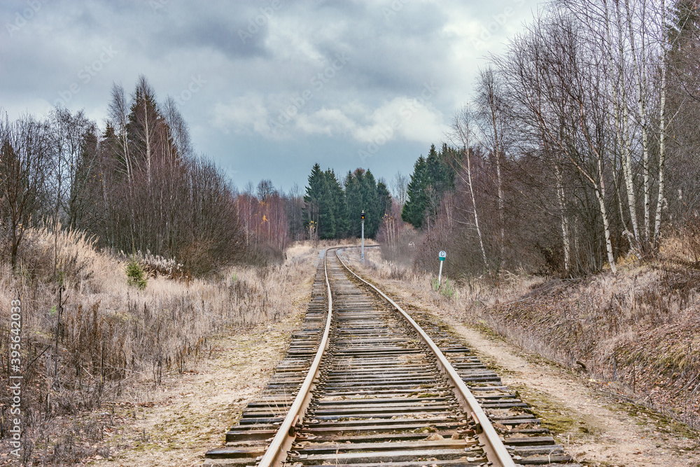 Single railway line in the autumn forest. Russia. Single railway line in the autumn forest. Russia.