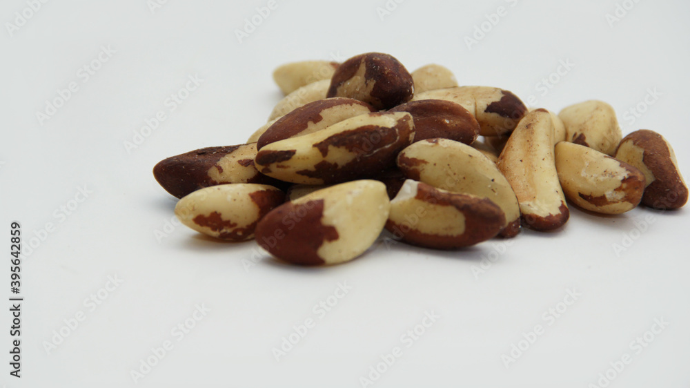 Brazil nuts scattered on a white background Brazil nuts scattered on a white background
