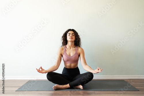 Beautiful young woman doing a meditation exercise