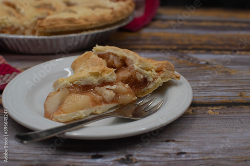 Home made apple pie on rustic wooden table, copy space