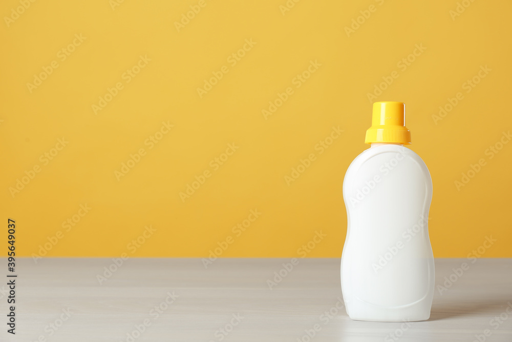 Bottle of cleaning product on light table. Space for text Bottle of cleaning product on light table. Space for text