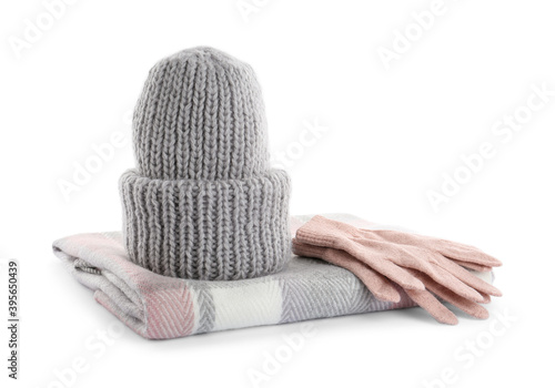 Woolen gloves, scarf and hat on white background photo