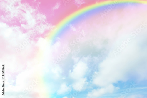 Amazing sky with rainbow and fluffy clouds, toned in unicorn colors © New Africa