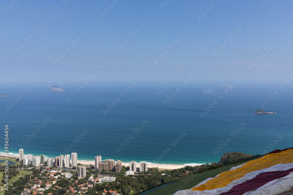 Beach landscape seen from the free flight ramp with part of the paraglider canvas open