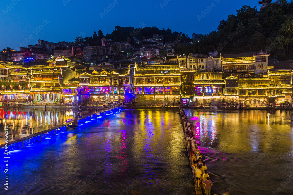 Footbridge and stepping stones across Tuo river in Fenghuang Ancient Town, Hunan province, China