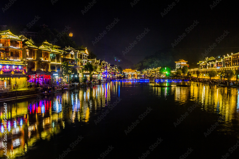 Evening view of Fenghuang Ancient Town with Tuo river, Hunan province, China