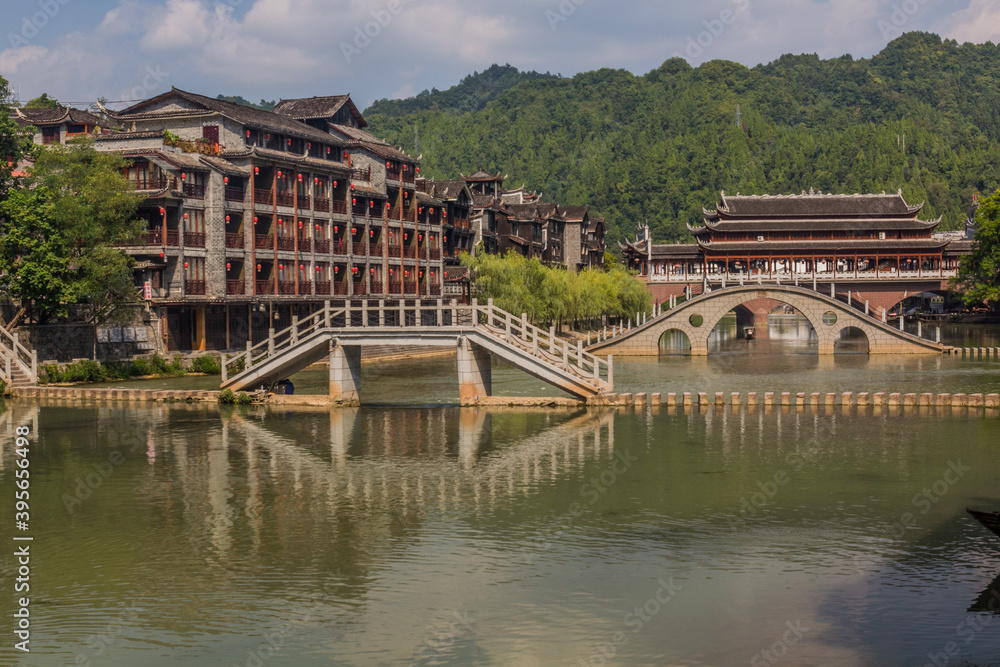 Bridges and stepping stones crossing Tuo river in Fenghuang Ancient City, Hunan province, China