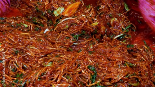 Korean food : Kimchi seasoning. It is the process of making kimchi seasoning. Mix together the ingredients for the kimchi. photo