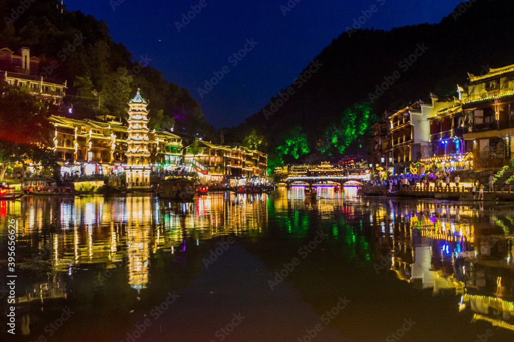 Evening view of riverside houses in Fenghuang Ancient Town, Hunan province, China