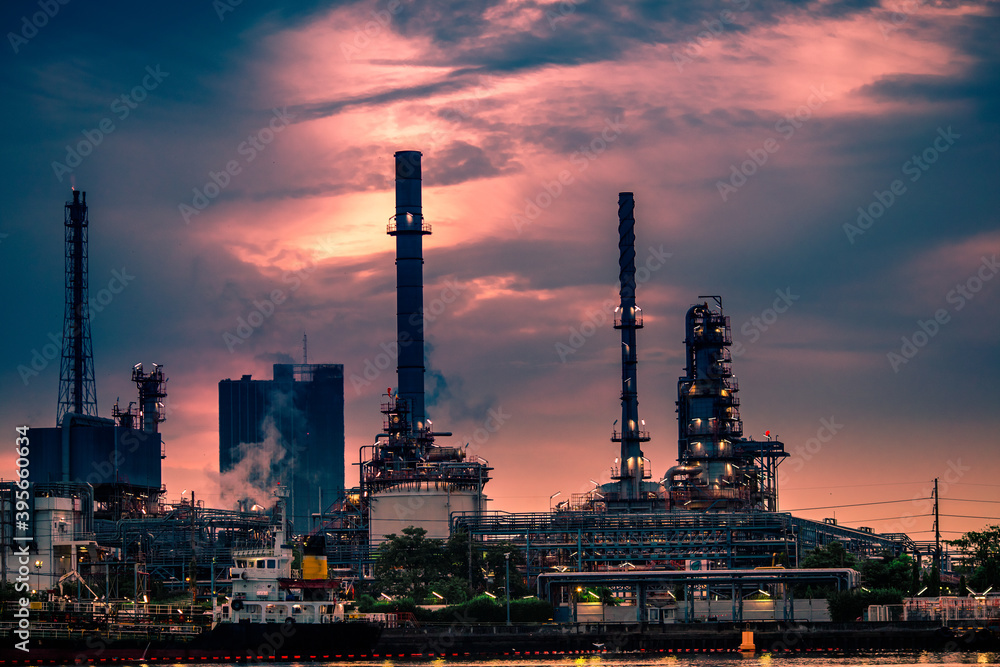 Fototapeta premium Blurred natural background of the morning sunshine along the river, breathtaking views (cargo ship, oil refinery), boat transportation