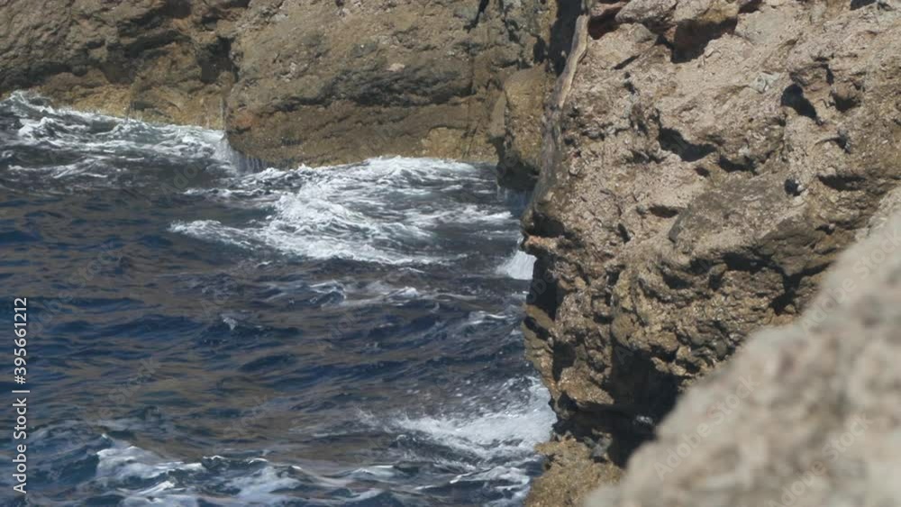 Waves crashing against the cliffs and creating a water explosion. Shot in slow motion. Waves crashing against the cliffs and creating a water explosion. Shot in slow motion.