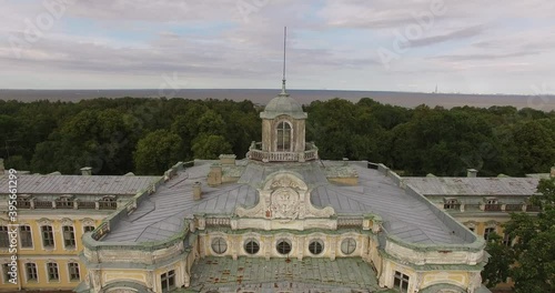 4K cloudy day aerial drone video of beautiful vintage architecture of Znamenka Estate, green park and palace near Peterhof center, in the suburbs of Saint Petersburg, the Russia's northern capital