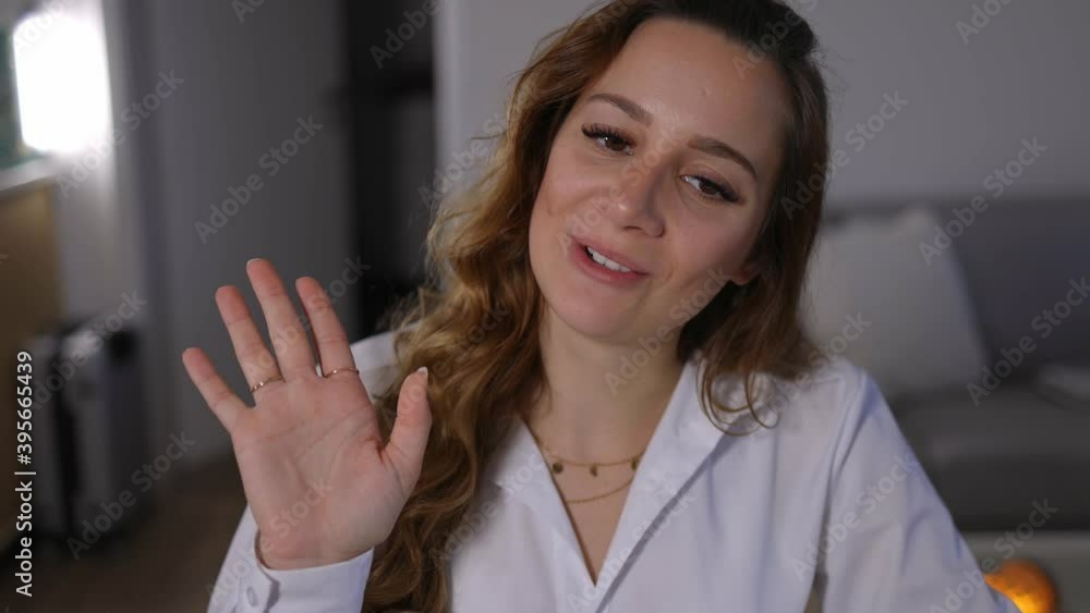 Young woman on a video conference call speaks to the webcam - videoclip Young woman on a video conference call speaks to the webcam - videoclip