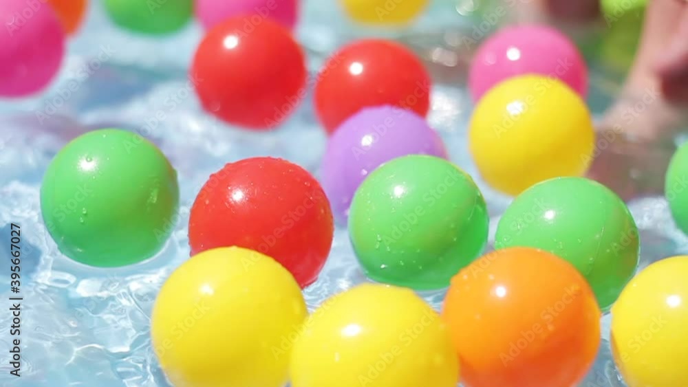 Balls Floating in Kiddie Pool Balls Floating in Kiddie Pool