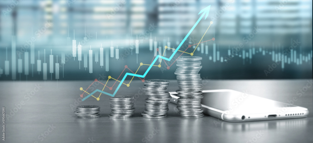 smartphone screen next to growing piles of coins and chart positive indicators smartphone screen next to growing piles of coins and chart positive indicators