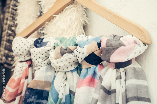 Εκτύπωση καμβά Closeup shot of scarves hanging on a coathanger