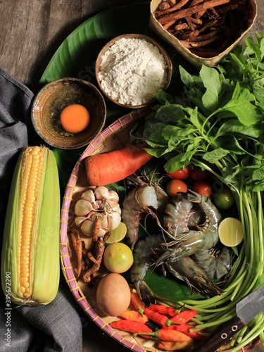 Selected Focus Flatlay Cooking Ingredients Preparation, Making Spinach Soup (Sayur Bayam) and Shrimp Tempura. Composition Raw Fresh Ingredients with Copy Space for Text or Advertisement