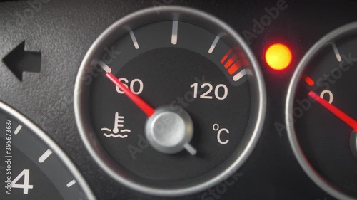 Oil Temperature Gauge and Indicator Lights of Starting and Stopping Car Close Up