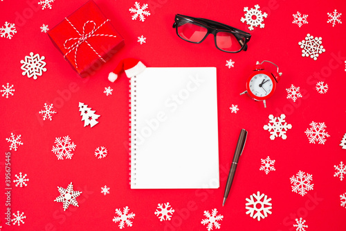 Notebook, glasses, gift boxes and Holiday decorations