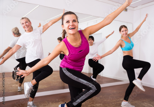 Women dancing aerobics at lesson in the dance class. High quality photo