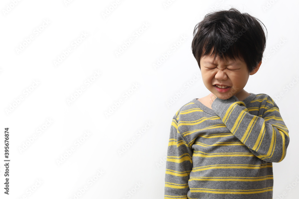 Little Asian boy holding his neck in pain, Sore Throat. Little Asian boy holding his neck in pain, Sore Throat.