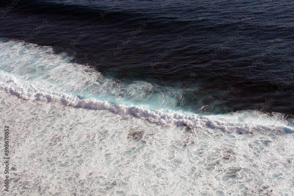 Aerial view of the coastline, wave pattern.